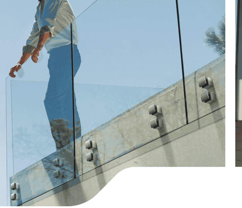 Frameless glass balustrade with stainless steel glass adapters